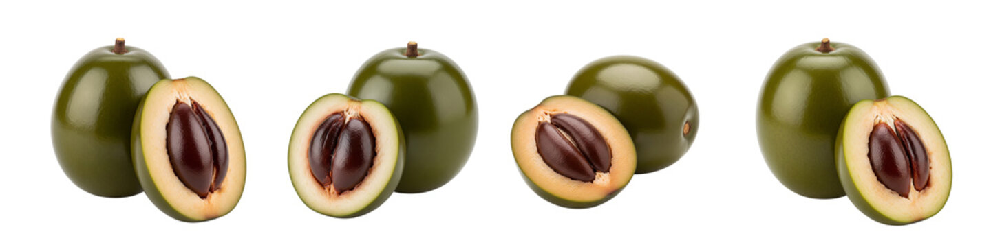 Four Ripe Green Star Apples Cut in Half Showing Purple Flesh and Seeds.