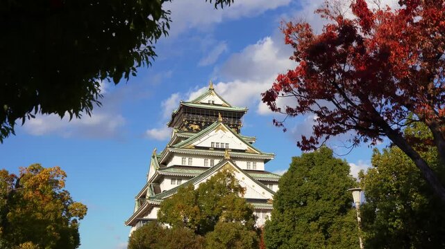 Iconic Osaka Castle with colorful foliage in Japan