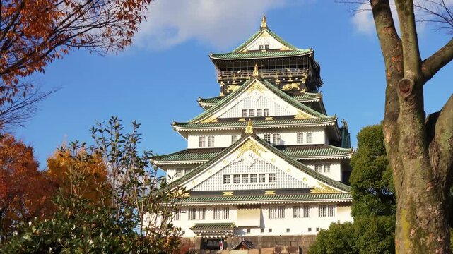 Osaka Castle zoom in shot with autumn trees in Japan