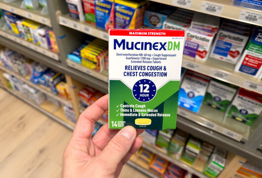 Mucinex DM Cough And Chest Congestion Medicine Box In Pharmacy