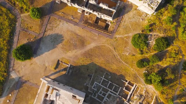 Gelemis, Turkey. Bird's eye view of Patara Ancient Theatre and Kursunlu Hill, architectural structure and landscape in summer morning. Aerial View, HEAD OVER SHOT with rotation, MasterShots