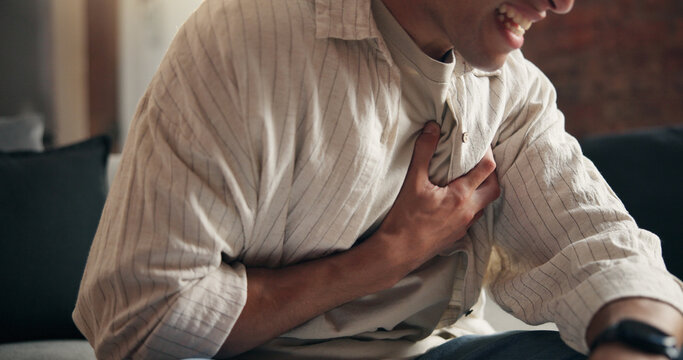Man, hands and sick in house with chest pain, heart attack symptoms or discomfort for medical emergency. Person, cardiac arrest or health issue in home with cardiovascular disease, illness or crisis.