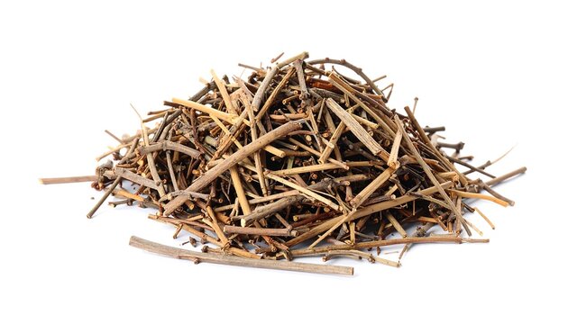 Pile of dried, thin sticks against a clean white backdrop