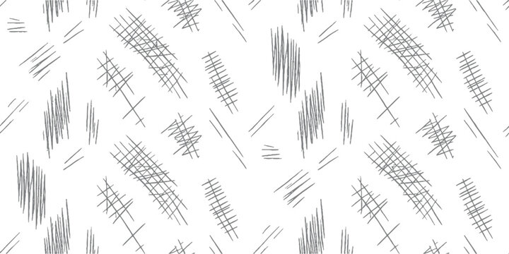 Seamless pattern of hand drawn grey scribbles and crosshatch marks on white background abstract black