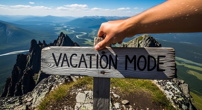 Hand holding vacation mode sign mountain.