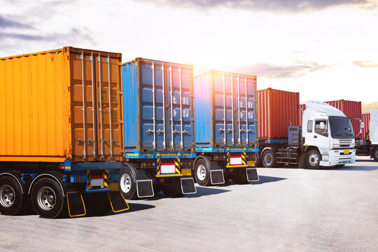 Row of Semi Trailer Trucks on The Parking Lot at The Port. Big Rig, Trucking. Shipping Cargo Container. Import-Export, Economy Business Transport on Road. Freight Transportation, Logistics Truck.
