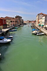 Fototapeta premium Canale di San Donato (San Donato Canal) viewed from Ponte San Donato (San Donato Bridge) in Murano, Italy