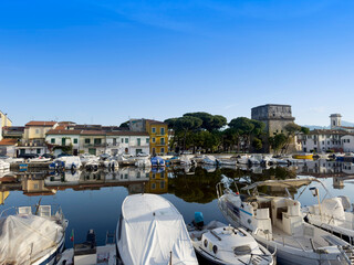 Matilde Tower in Viareggio with reflection water boats Tuscany