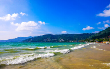 Obraz premium Tropical Patong Beach turquoise blue clear water and waves Thailand.