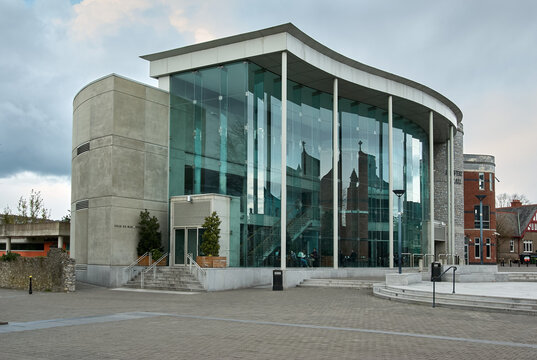 The modern glass-fronted Devere Hall and student center building at University College Cork campus, Cork City, County Cork, Ireland.