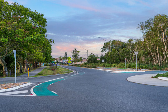 Buttler Street, Byron Bay, New South Wales, Australia. View of the empty street and the foliage during sunset.