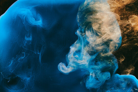 Abstract colorful blue smoke on black background. Moving flow of paints, fluid liquid art, space sky