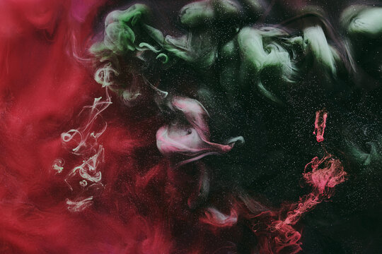 Abstract red green background. Moving smoke flow, fluid liquid art