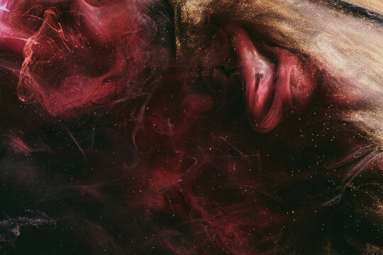 Abstract colorful red black background. Moving flow of paints, fluid liquid art, space sky