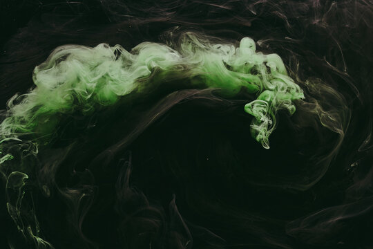 Abstract green background. Moving smoke flow, fluid liquid art.