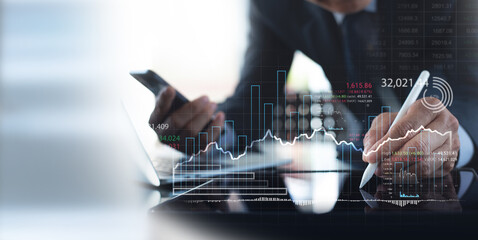 Stock market analysis, business, finance and investment. Finance analyst analyzing stock market trading graph, economic growth chart, planning and strategy, business investment with financial report