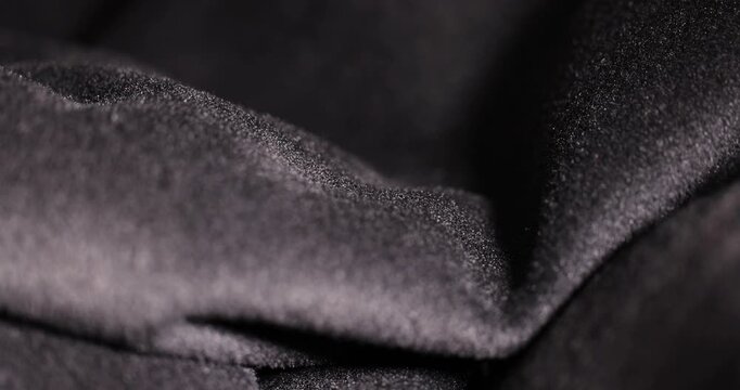 Black textiles, frost-resistant grey textiles with thick pile and voluminous waves in natural light with clear details and an authentic look of the material.
