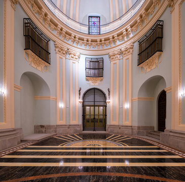 Restored monastery basilica interior with marble floor