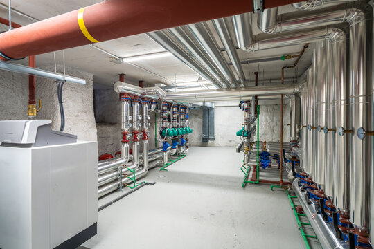 Modern boiler room with insulated pipes and valves