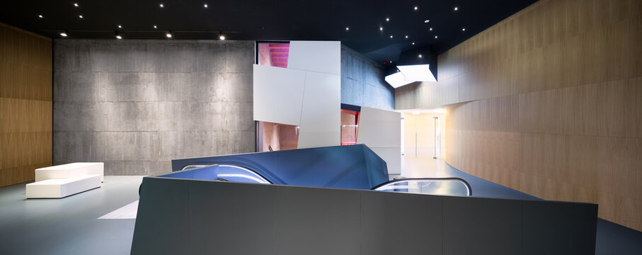 Modern interior of art exhibition space with escalator