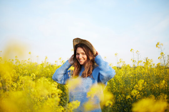 Woman in flower field during springtime