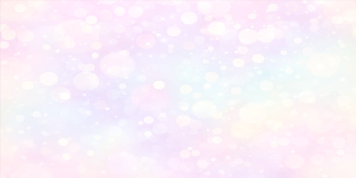 Abstract colorful bokeh background with bright glowing lights and pink blue glitter sparkles creating a festive holiday winter pattern for a blurred backdrop design