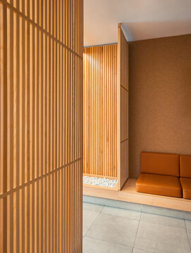 Modern wooden interior with brown leather sofa