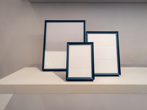 Black frames on a shelf for design presentation mockup
