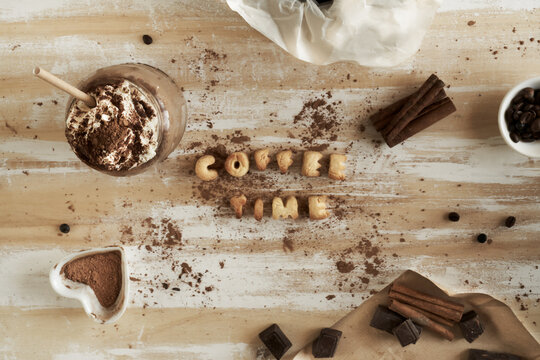 Overhead flat lay of COFFEE TIME cookies with whipped drink