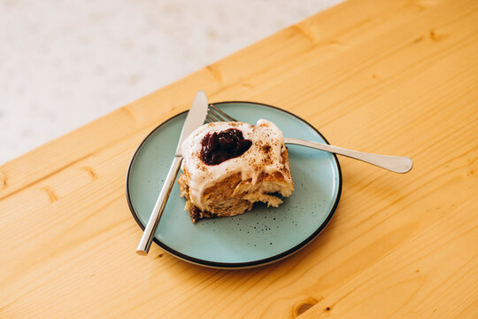 Morning cherry Cinnabon dessert bite on plate with forks