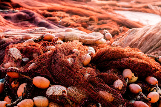 Fishnet pile with floats in harbor, close-up texture shot