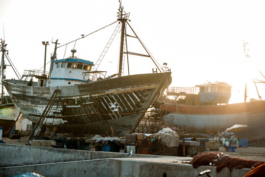 Fishing boat and fishnet pile in Essaouira harbor
