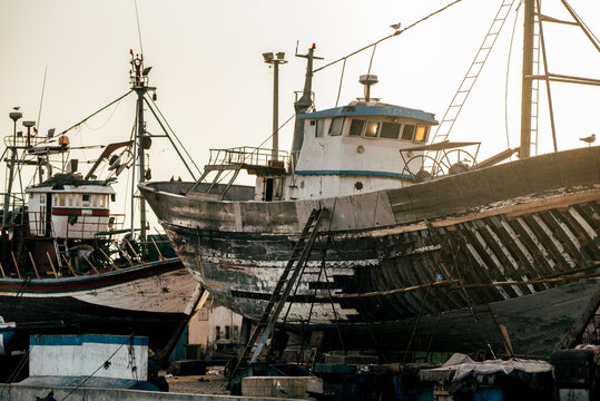 Anchored fishing boat in Essaouira harbor at dusk