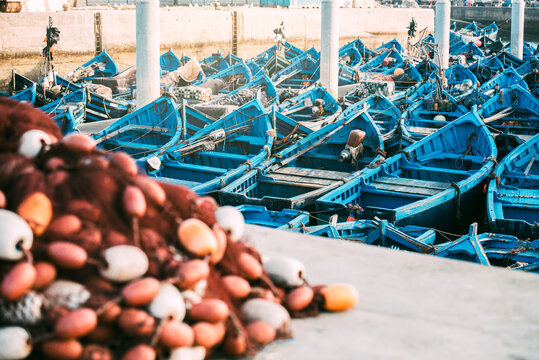 Crowded blue fishing boats anchored in Marrakech harbor