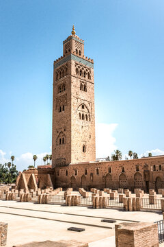 Historic mosque minaret tower in Morocco under blue sky