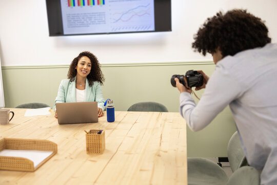 Latino office team creating content in coworking space