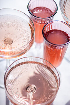 Sparkling pink drinks in elegant glassware