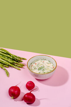 Cold okroshka soup with kefir, asparagus and radish