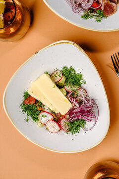 Fresh vegetable salad with brynza cheese and dill
