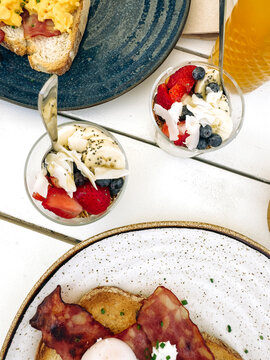Delicious breakfast spread with fresh fruit parfaits