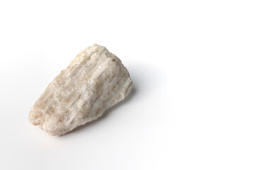 Obraz premium Lithium ore, hard rock spodumene. Isolated on white background. Critical battery mineral, raw material. Mine, mining, natural resources. Copy space