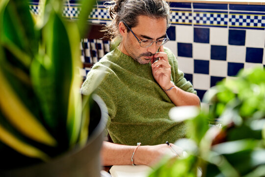 Man engaged in work from home task,