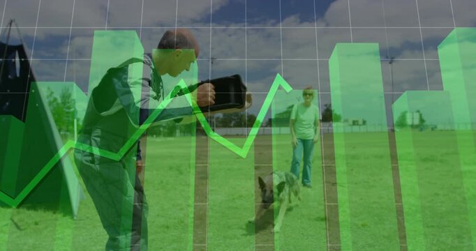 Trainer guiding bite as handler letting dog, dog holding sleeve in training, green chart overlaying