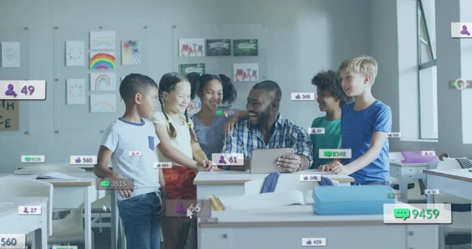 Smiling teacher in checked shirt guiding five kids around desk in classroom, with tablet icons
