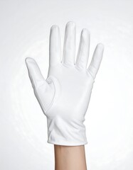 Obraz premium Close-up of a hand wearing a white leather glove, palm facing forward