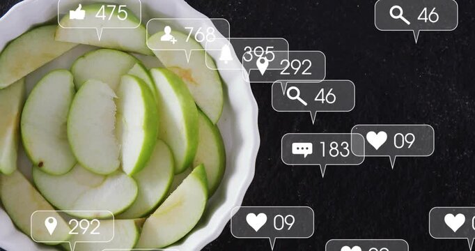 Vertical video: Emerging UI bubbles from right over dish of sliced apples in kitchen raising counts