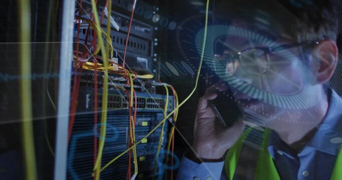 Male tech taking call, inspecting rack in datacenter while HUD overlay pulsing, relaying fixes