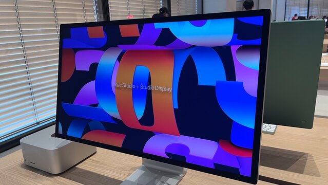 Apple Mac Studio and Studio Display high-performance desktop computer showcased with a colorful screen in a retail store - Tokyo, Japan, December 13, 2025