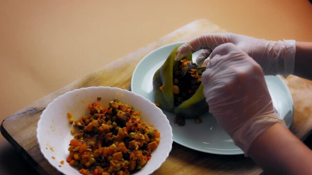 The roasted pepper is stuffed with the filling for Chiles Poblanos