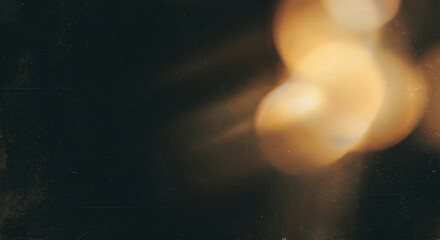 Warm golden light bokeh on dark abstract blurry glow effect white paper background,grunge film background © Sanoor